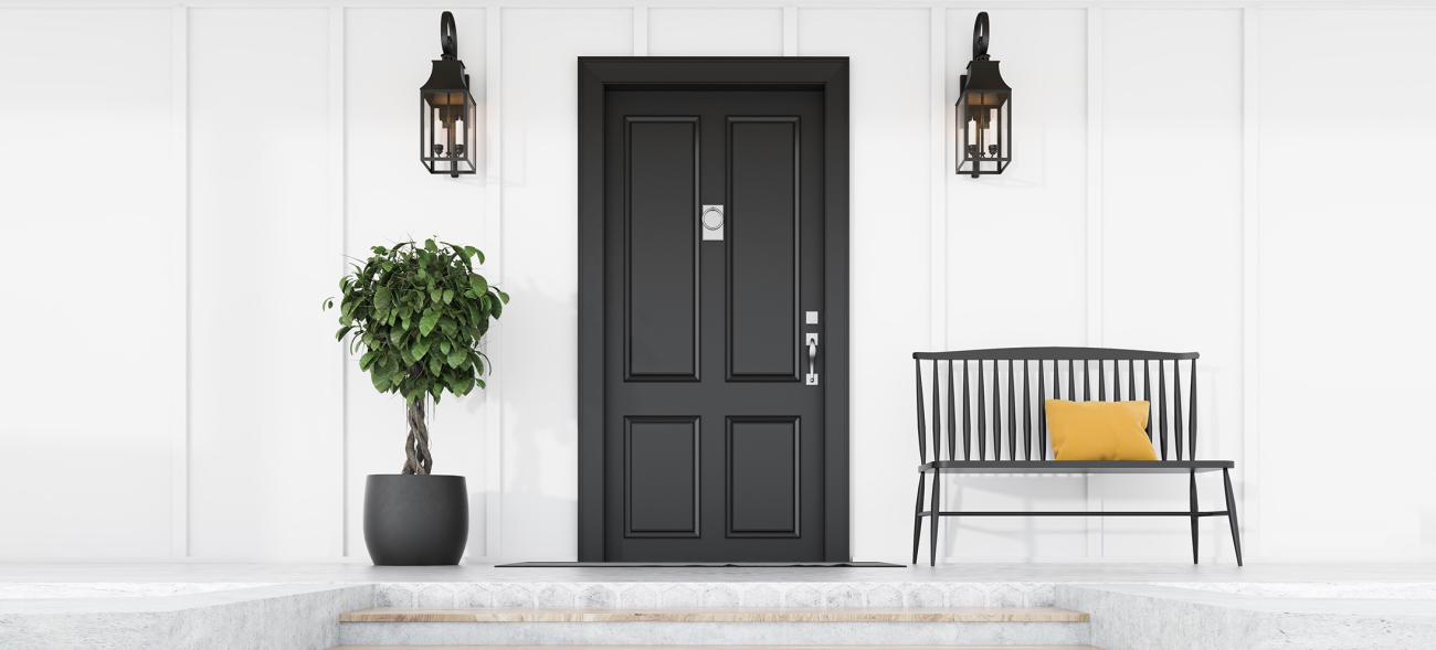 photo of a front porch, door and welcoming bench